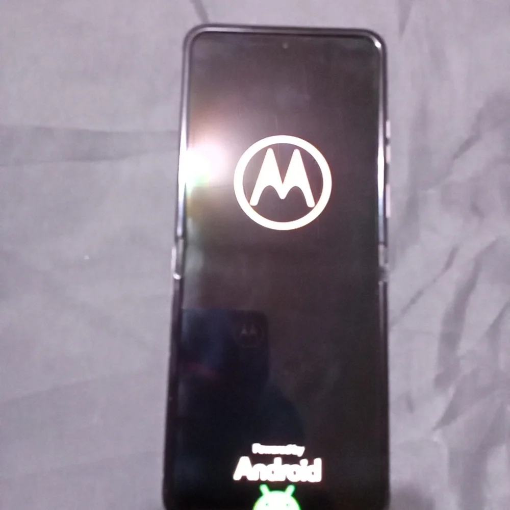 Motorola Smartphone with Blue and Purple Accents Come With A Purple Phone Case